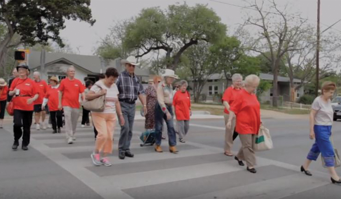 Older residents of South Austin, Texas, use a crosswalk they advocated to have installed. 