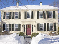A New England house after a snow.