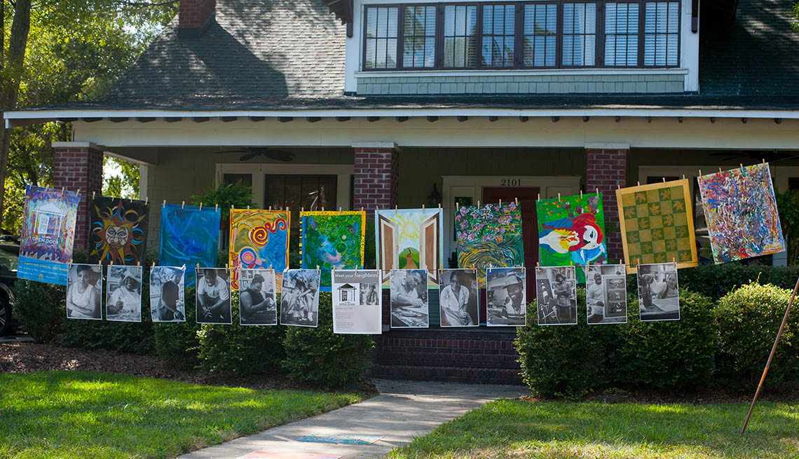 Artwork Hangs From Clothesline In Front Of House, Inspiring Livability Efforts, Livable Communities