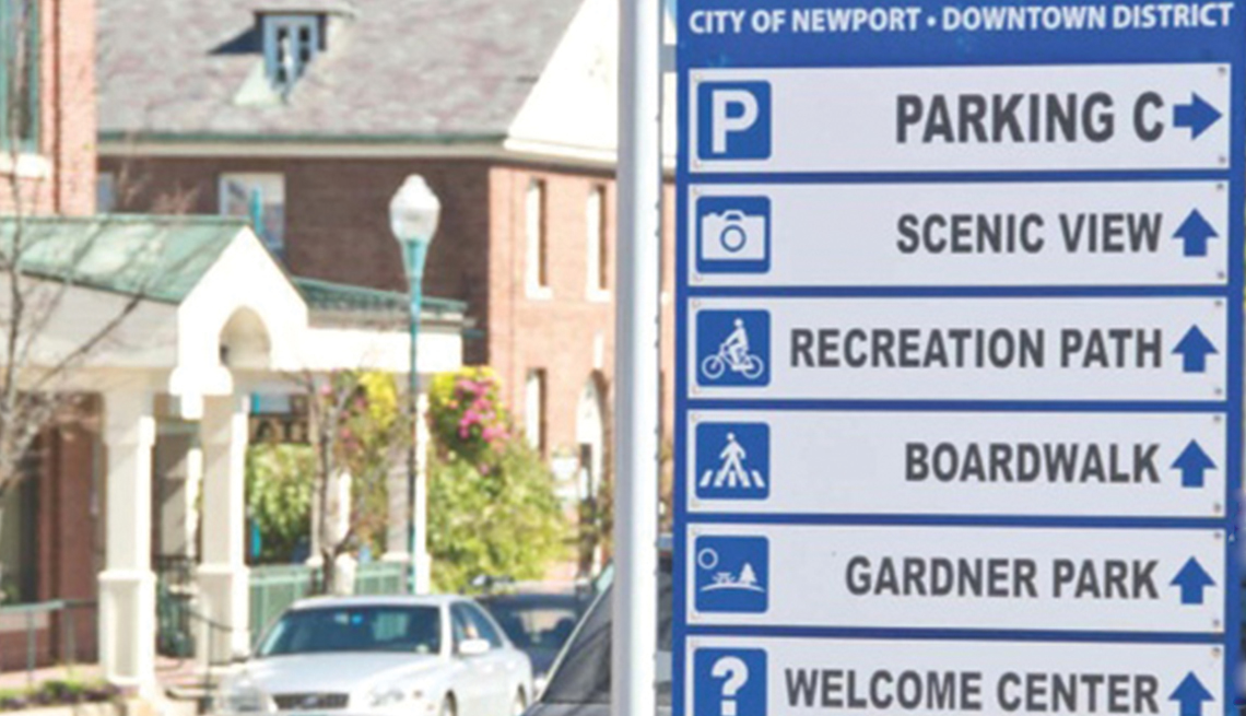 City of Newport Downtown District direction sign to parking, scenic view, recreation path, boardwalk, Gardner Park, welcome center
