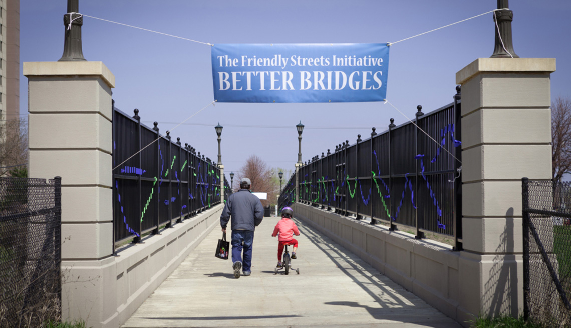 Father And Daughter On Bike Cross A Bridge, Friendly Streets Initiative, Livable Communities
