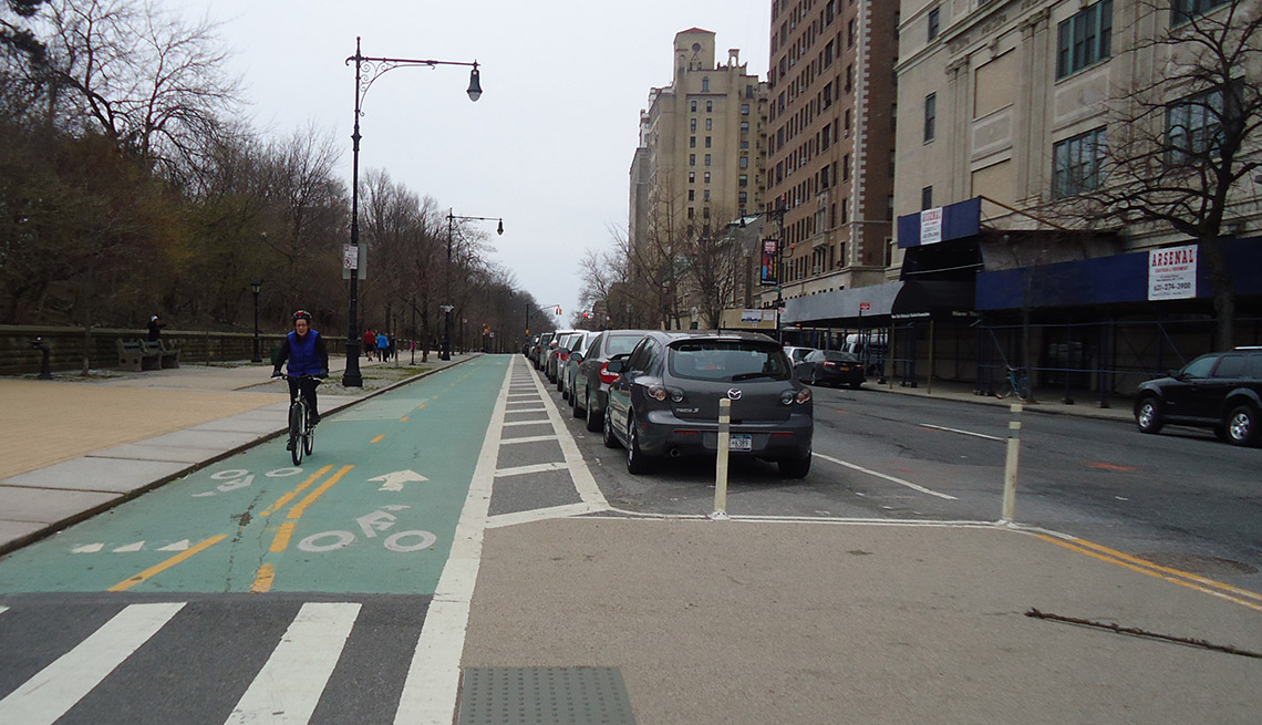Man Rides His Bicycle In Dedicated Bike Lane, Sidewalk, Crosswalk, Prospect Park, Brooklyn, New York, City, Livable Communities, Biking Infrastructure