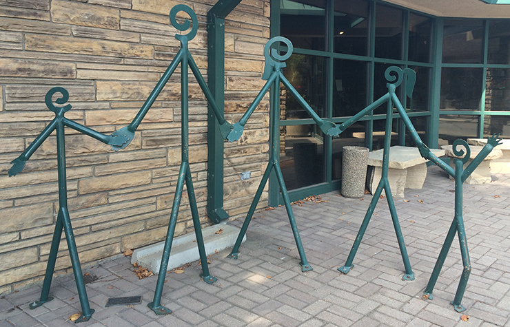 A bicycle rack sculpture shaped like a stick-figure family of five, Loveland, Colorado