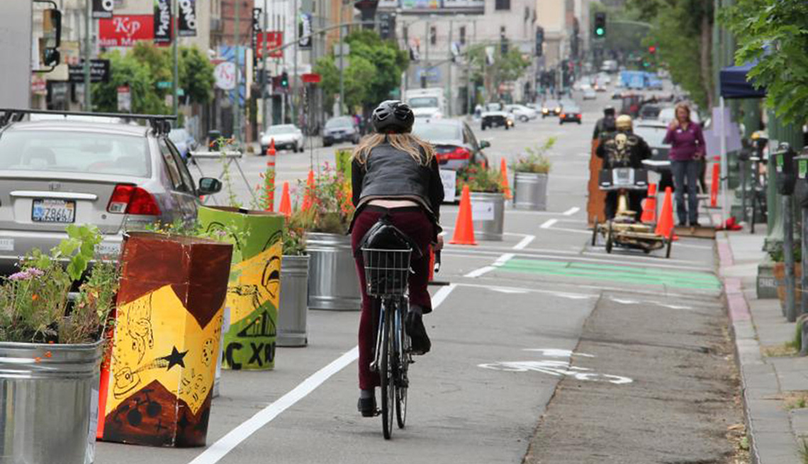Bike Rider Enjoys Dedicated Bike Lane, Pop Up Bikelanes, Livable Communities