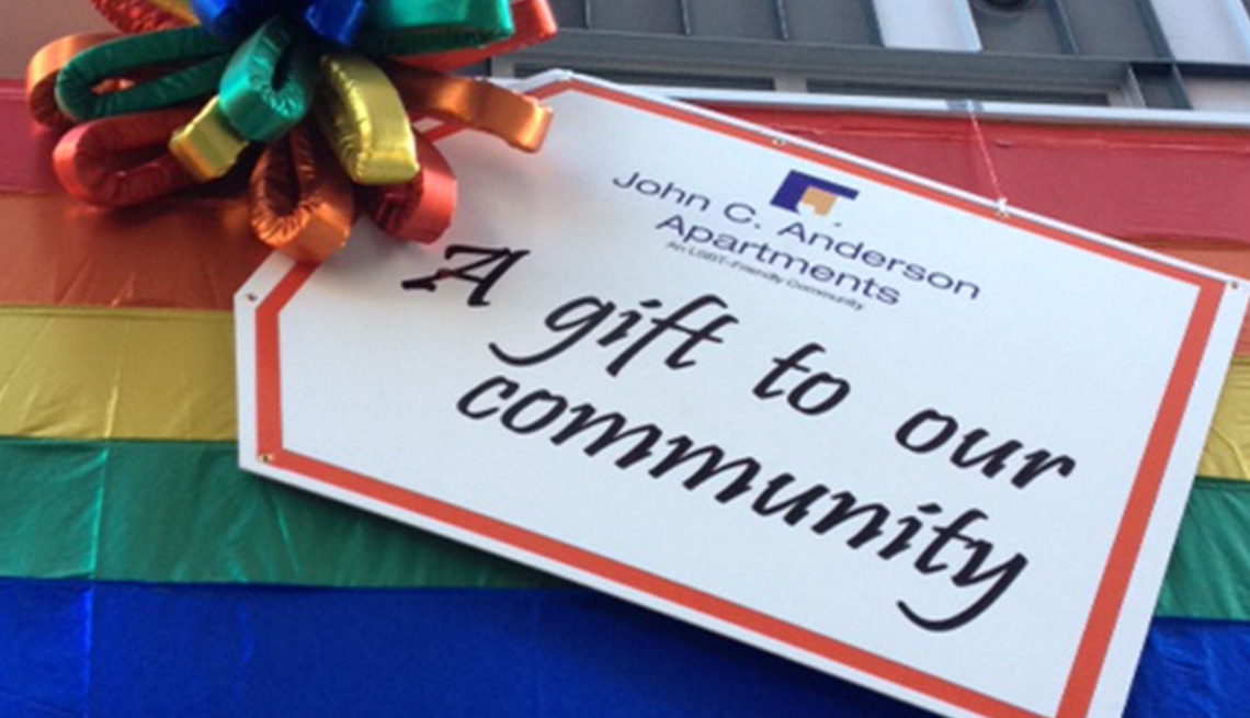 A gift tag on the John C. Anderson Apartments that says A Gift to Our Community