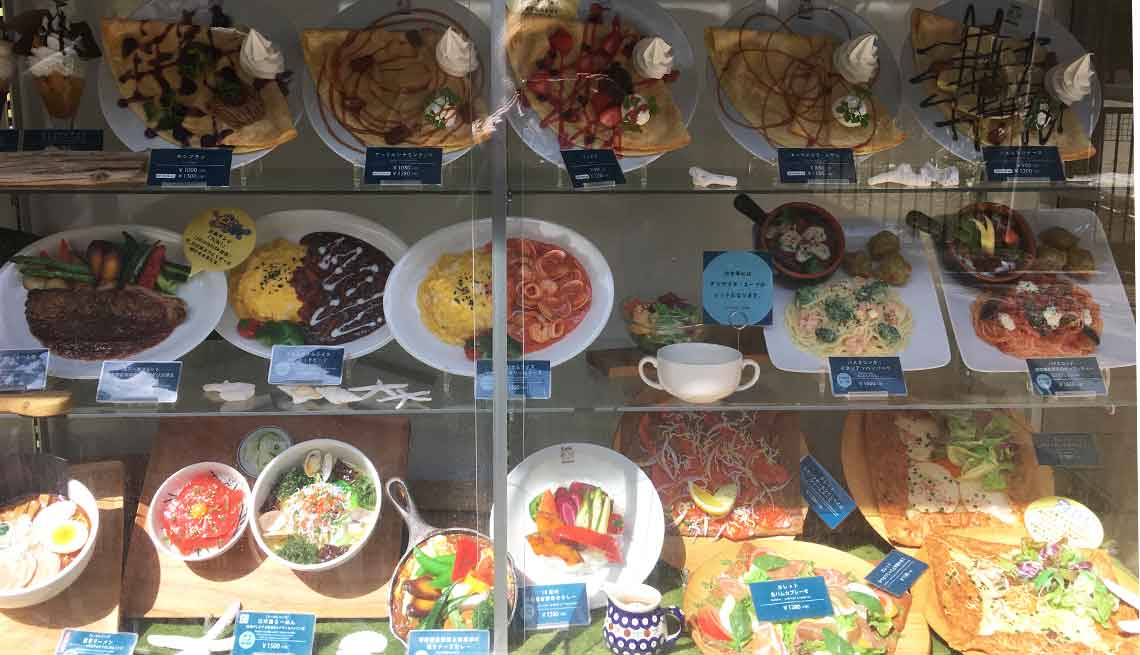 A plastic food display in the window of a restaurant in Japan.