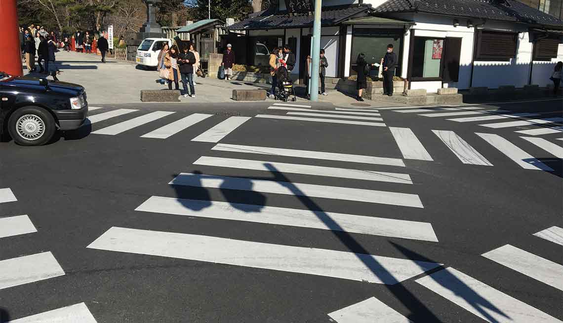 Multiple crosswalks provide paths for pedestrians in Kamakura, Japan.