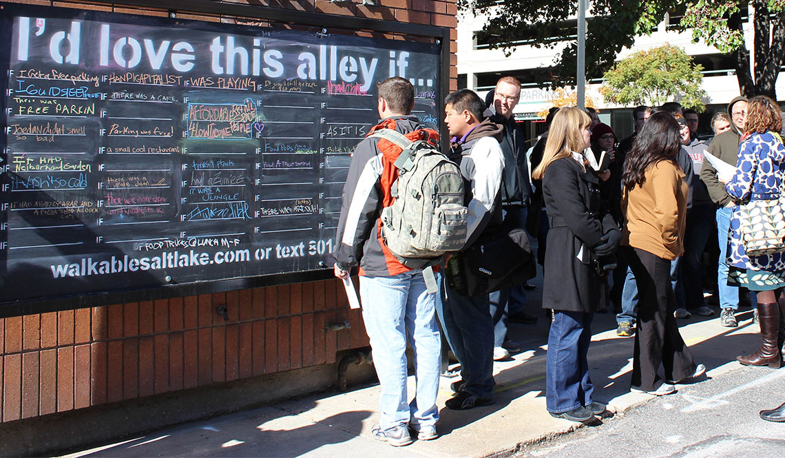 The 'I'd love this alley if ...' chalkboard attracted attention and comments in downtown Salt Lake City.