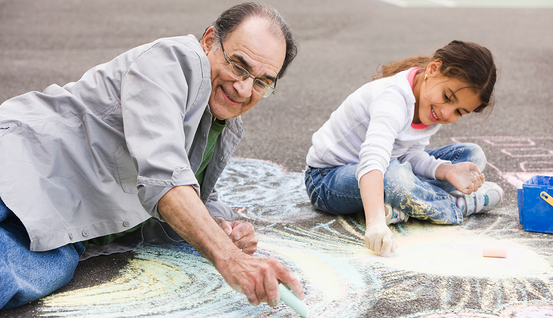 Hispanic grandfather and granddaughter, drawing, sidewalk, chalk, Livable Communities, AARP Network of Age-Friendly communities