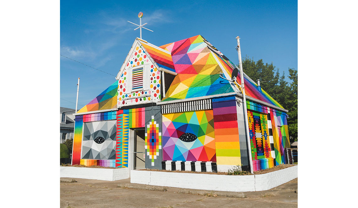 An abandoned house as painted in bright colors by muralist Okuda San Miguel