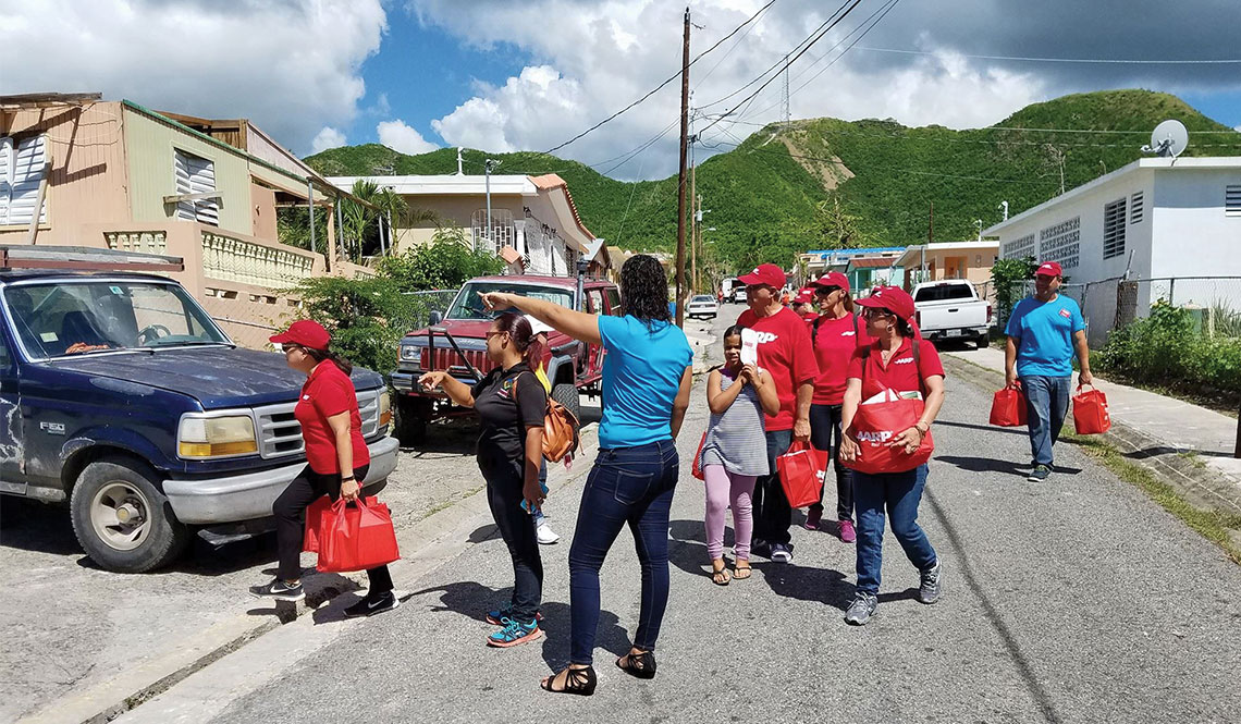 Staff and volunteers from AARP Puerto Rico deliver food to older adults after Hurricane Maria.