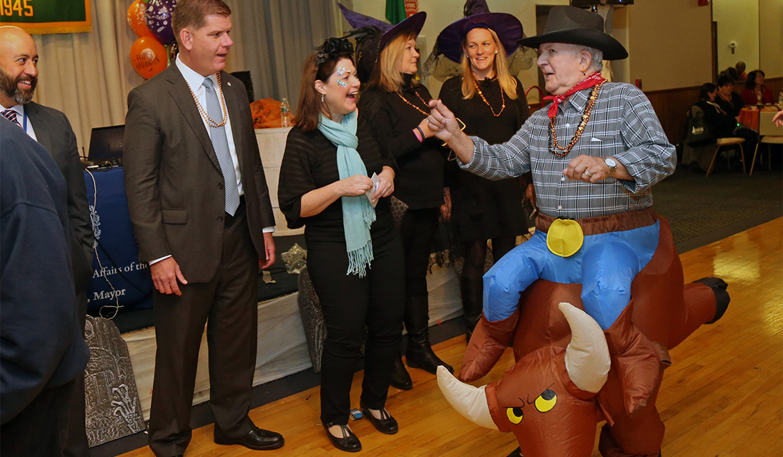 Emily Shea (laughing) and Boston Mayor Martin Walsh (second from left) at a Halloween event