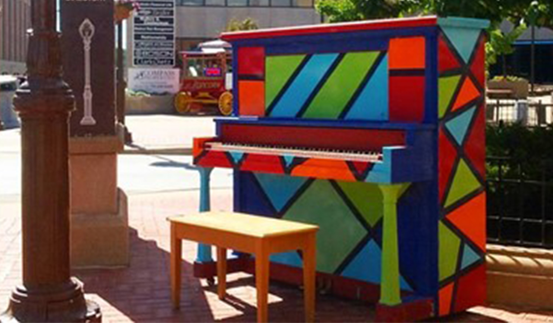 A colorfully painted outdoor piano