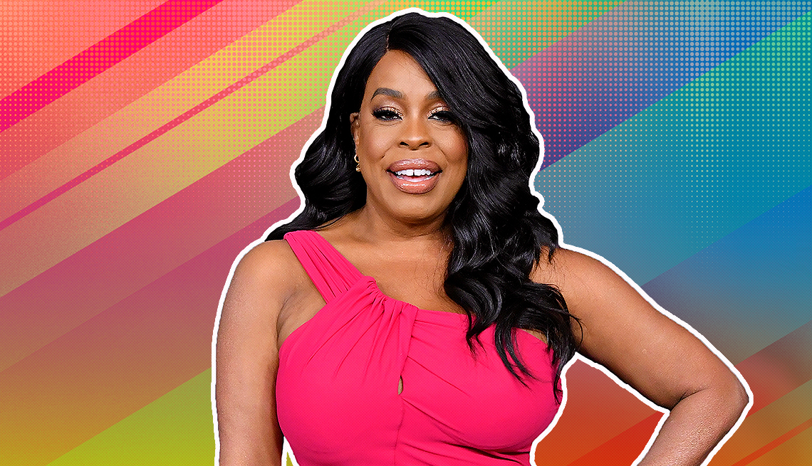 item 6 of Gallery image - Niecy Nash outlined against a rainbow ombre background