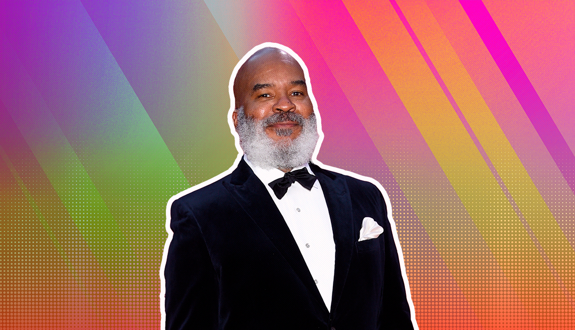 David Alan Grier outlined against a rainbow ombre background
