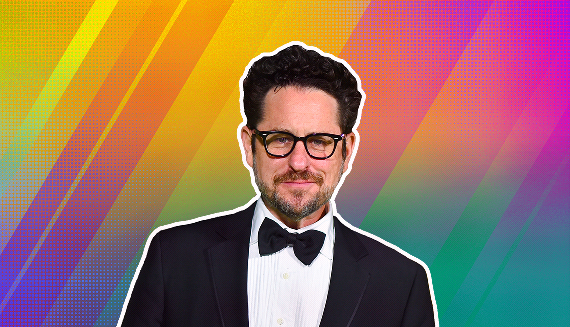 J.J. Abrams outlined against a rainbow ombre background