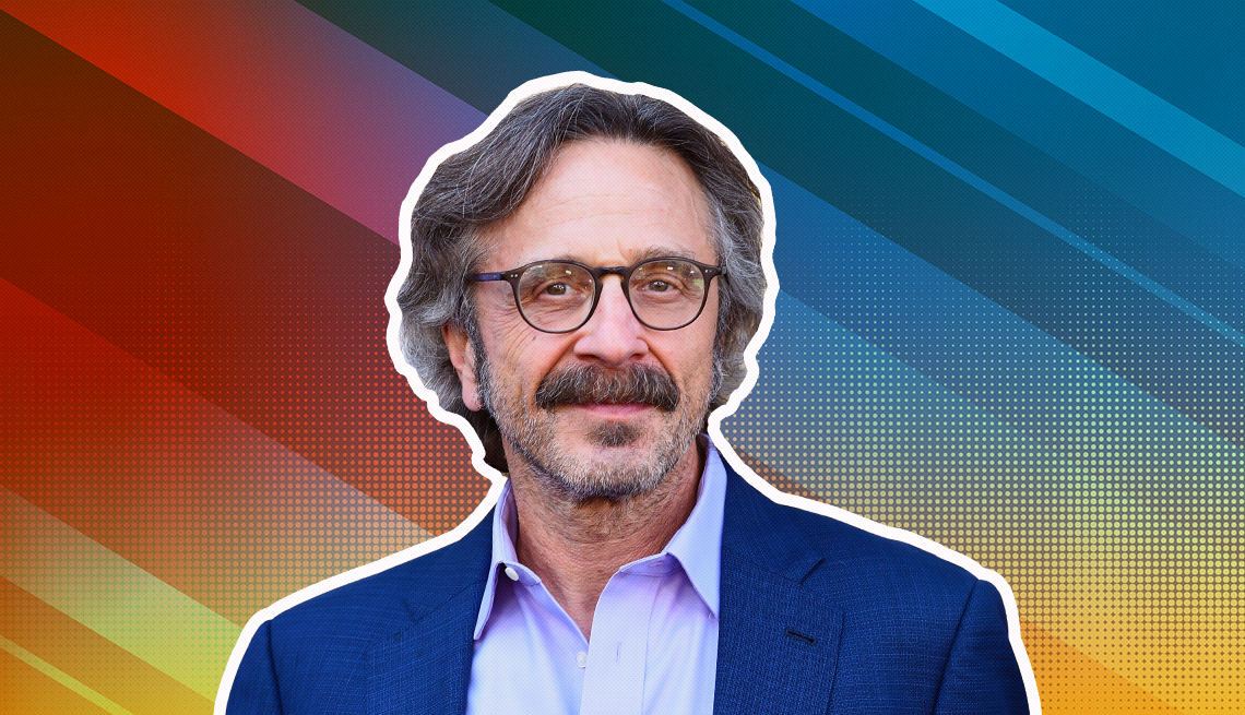 Marc Maron outlined against a rainbow ombre background