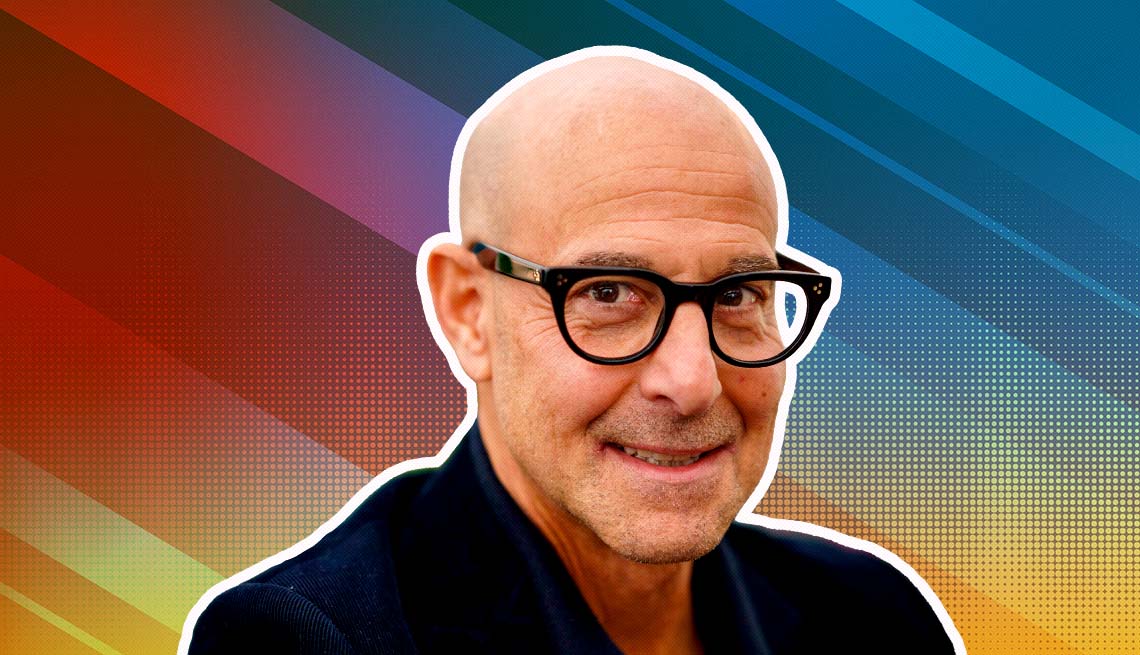 stanley tucci outlined against a rainbow ombre background