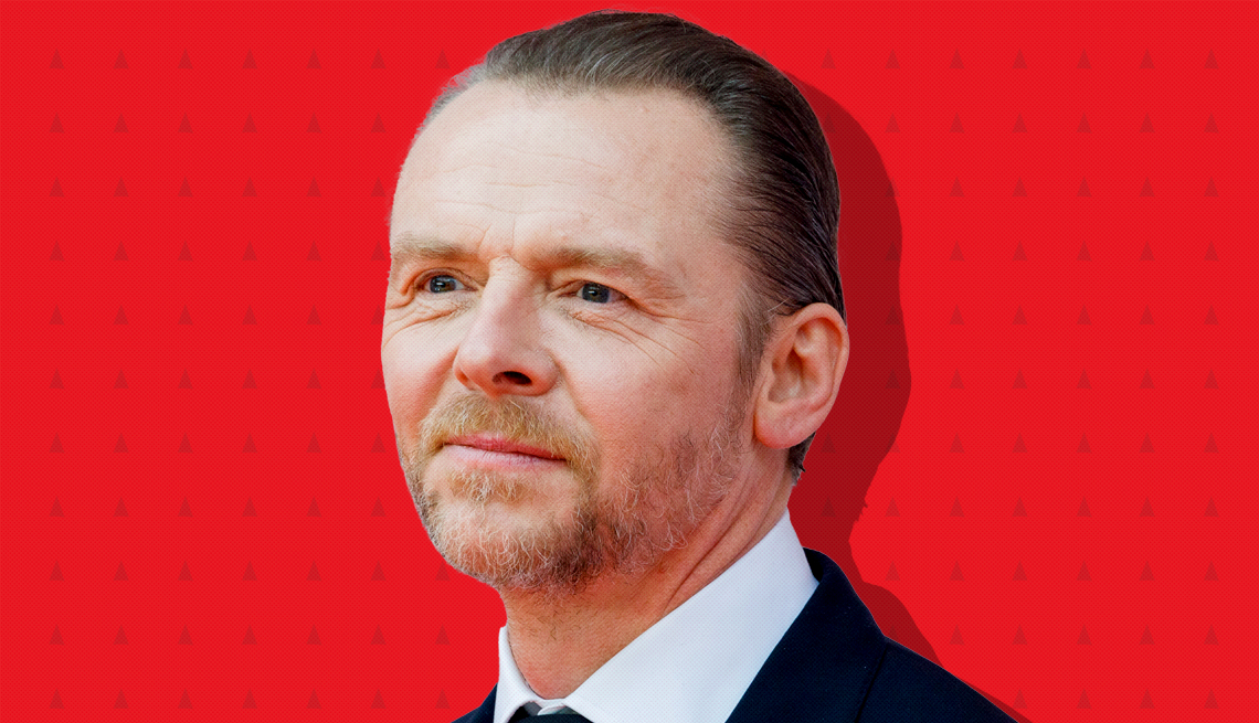 item 15 of Gallery image - simon pegg against red background with mini triangles