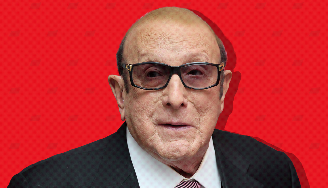 item 27 of Gallery image - clive davis against red background with mini shapes