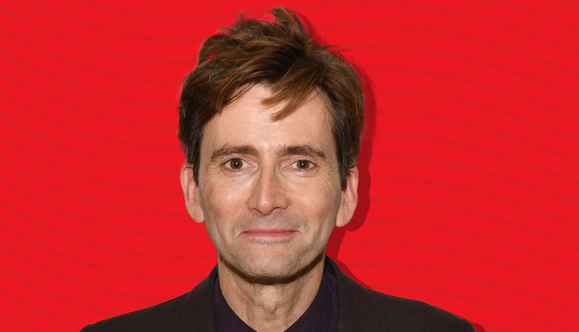 item 13 of Gallery image - david tennant against red background with curved lines going horizontally from one end to the other