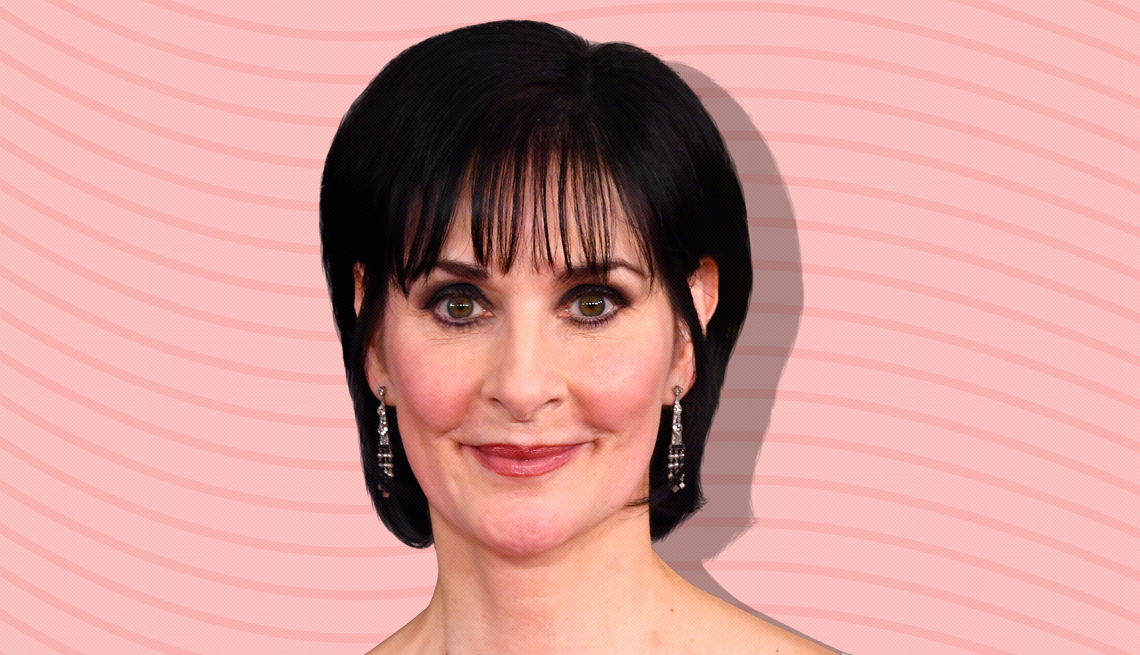 item 15 of Gallery image - enya against light pink background with curved lines going horizontally from one end to the other