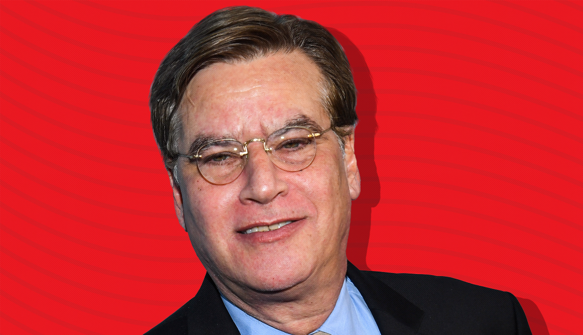 item 22 of Gallery image - aaron sorkin against red background with curved lines going horizontally from one end to the other