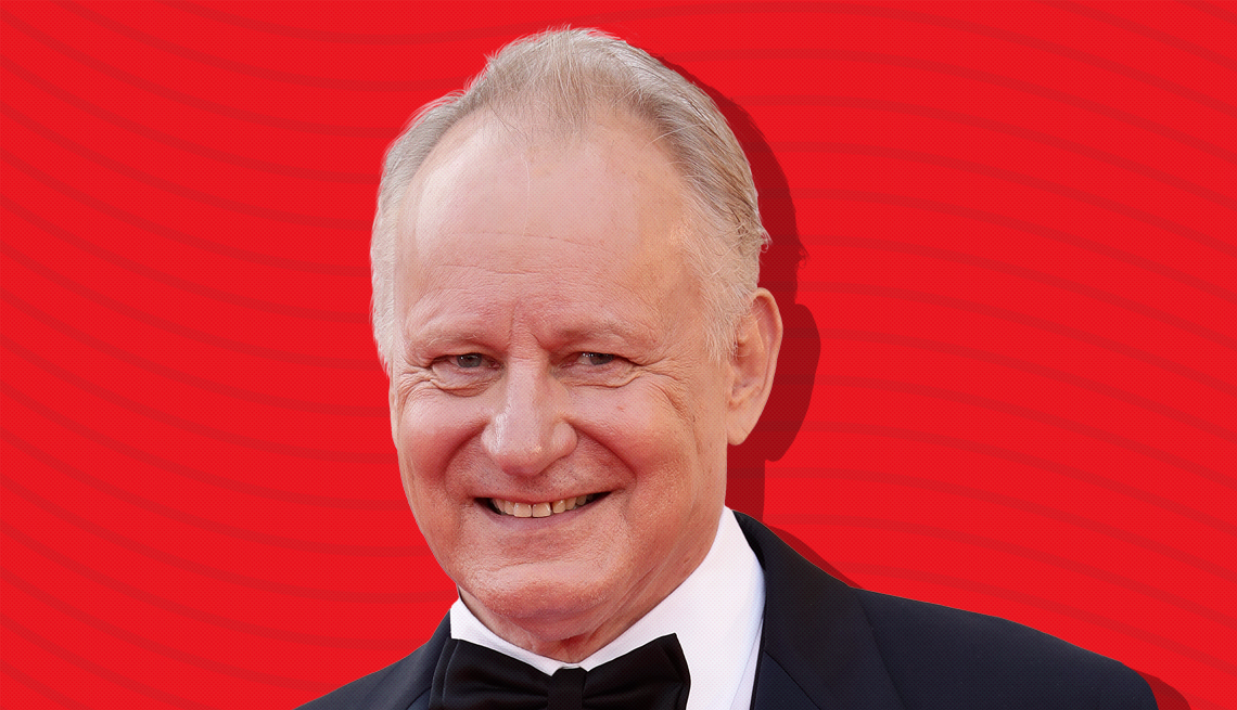 item 18 of Gallery image - stellan skarsgard against red background with curved lines going horizontally from one end to the other