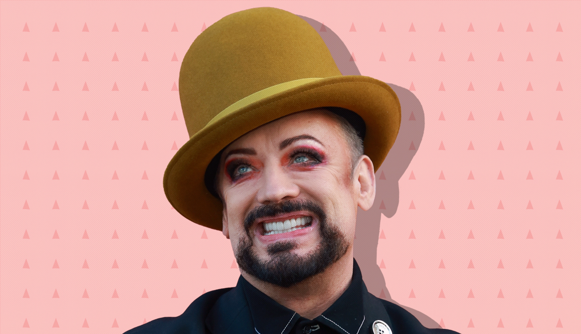 item 17 of Gallery image - boy george against light pink background with mini triangles