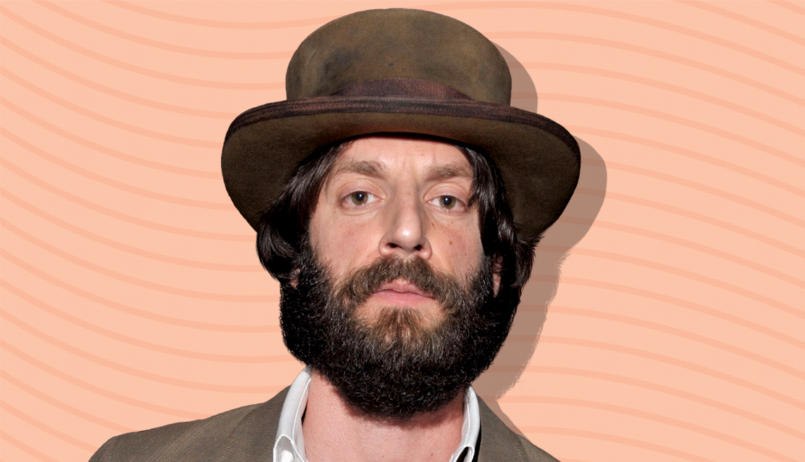 item 13 of Gallery image - ray lamontagne against peach colored background with curved lines going horizontally from one end to the other