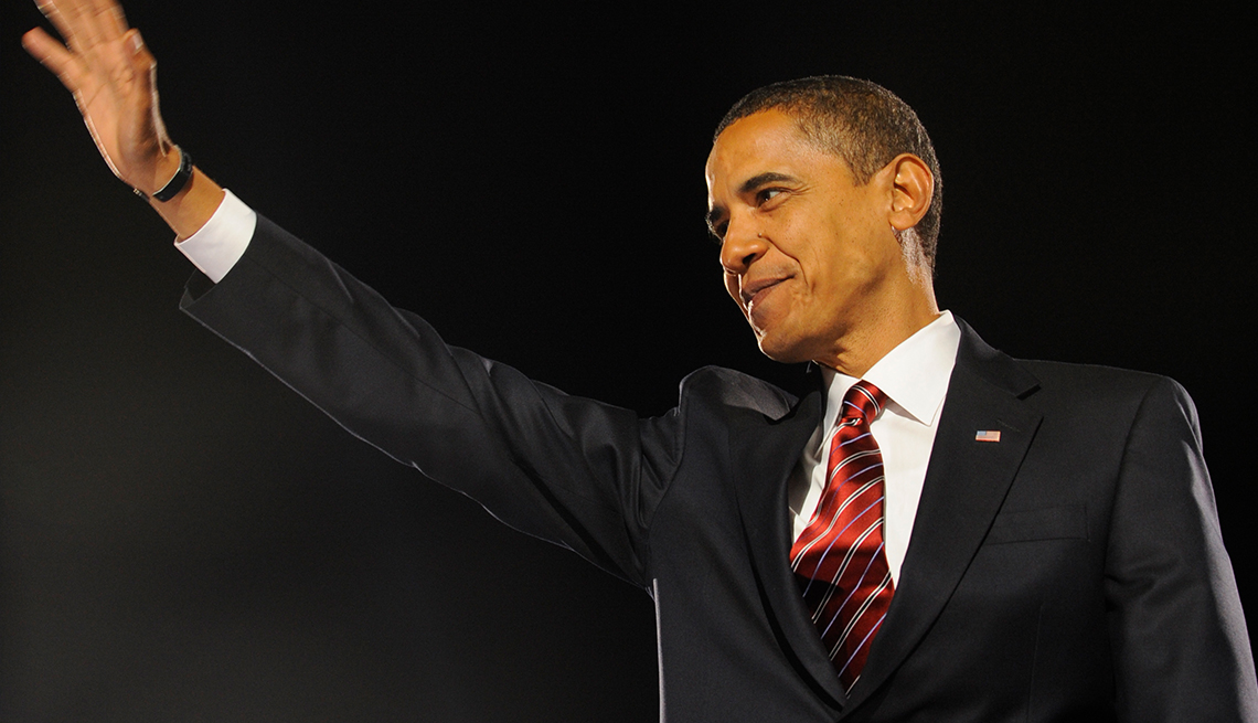 item 27 of Gallery image - Barack Obama smiling with hand raised