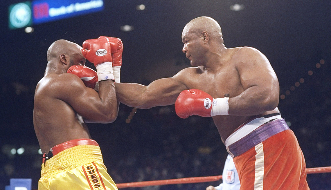 item 26 of Gallery image - George Foreman punching Michael Moorer in boxing ring