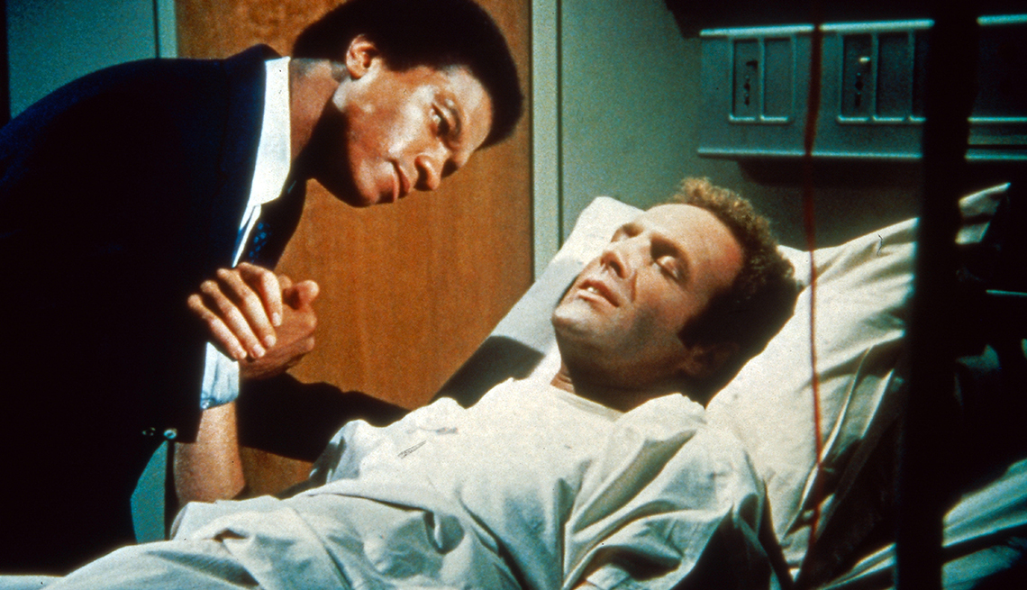 item 1 of Gallery image - Gale Sayers (Billy Dee Williams) and Brian Piccolo (James Caan) in hospital room scene in 'Brian's Song'