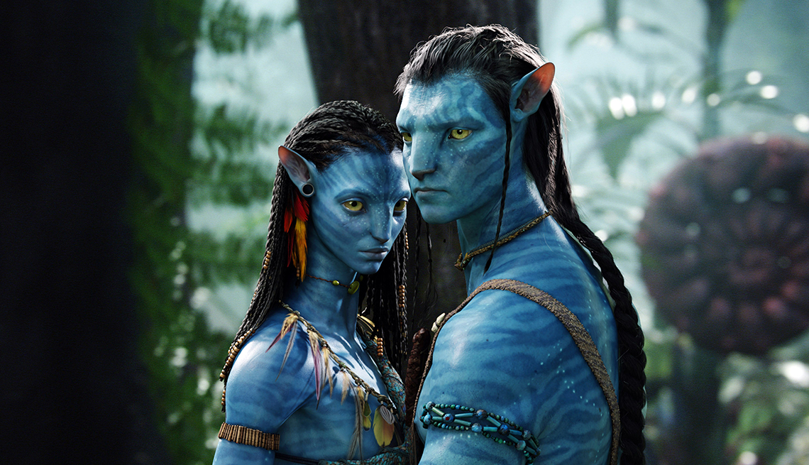 item 14 of Gallery image - Avatar main characters Jake Sully and Neytiri stand close to one another in the forest