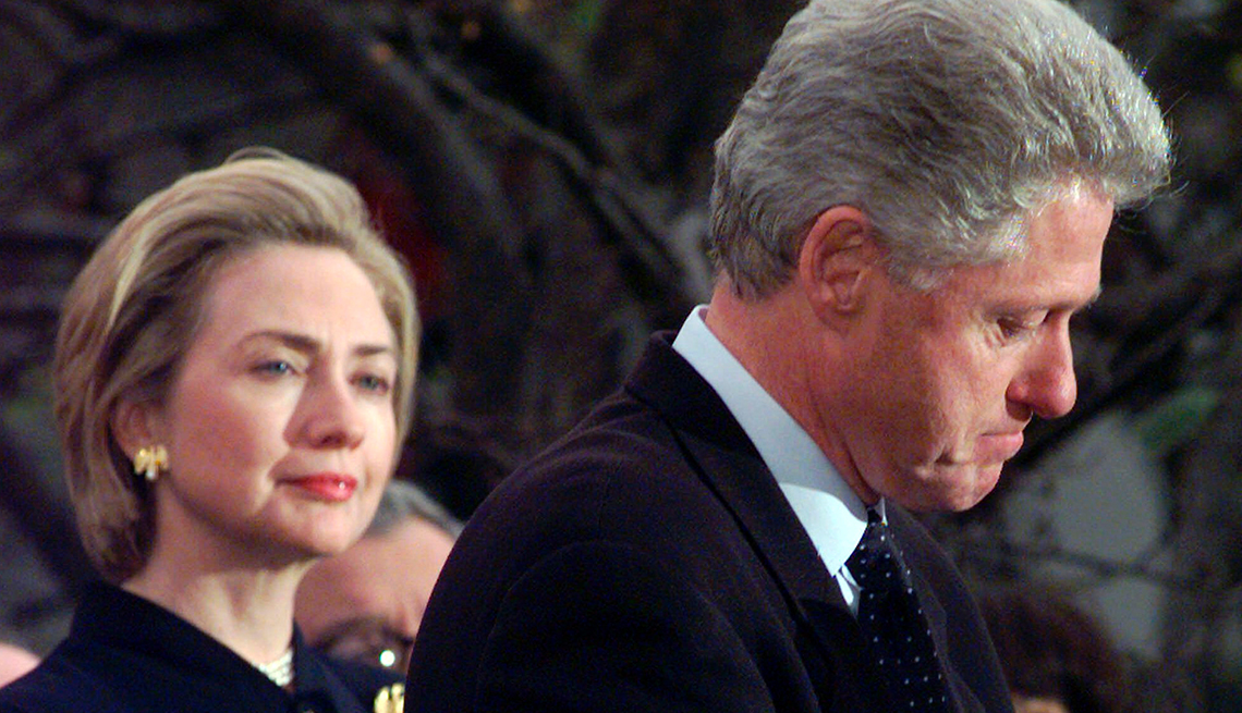 item 13 of Gallery image - First Lady Hillary Clinton looks at a frowning President Bill Clinton