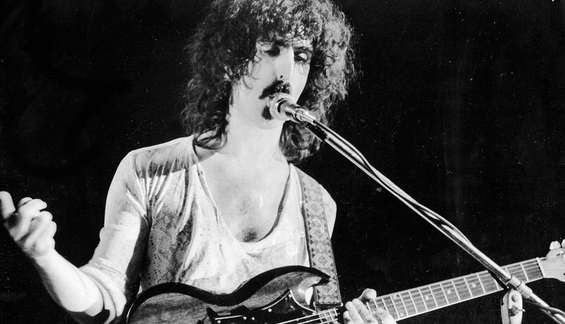 item 28 of Gallery image - Frank Zappa onstage at microphone with guitar