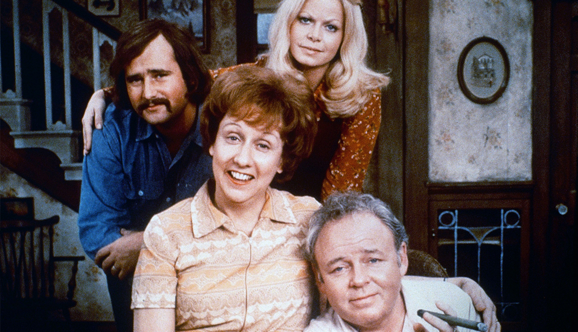 item 20 of Gallery image - ‘All In the Family’ cast members Rob Reiner, Jean Stapleton, Sally Struthers and Carroll O’Connor pose in the living room on the show’s set