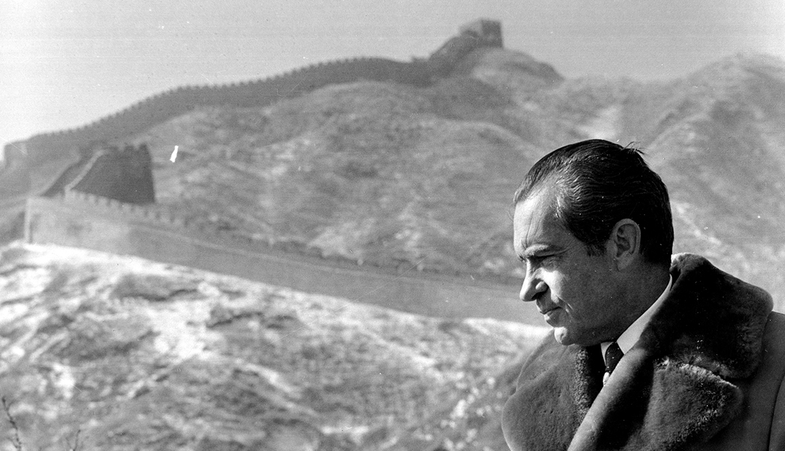 item 5 of Gallery image - a black and white photograph of the late President Richard Nixon in profile, frowning, with the Great Wall of China in the background