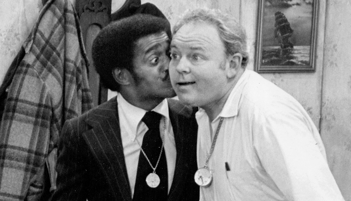 item 10 of Gallery image - a black and white photo shows Sammy Davis Jr. kissing Carroll O'Connor on the cheek on the set of 'All In The Family'