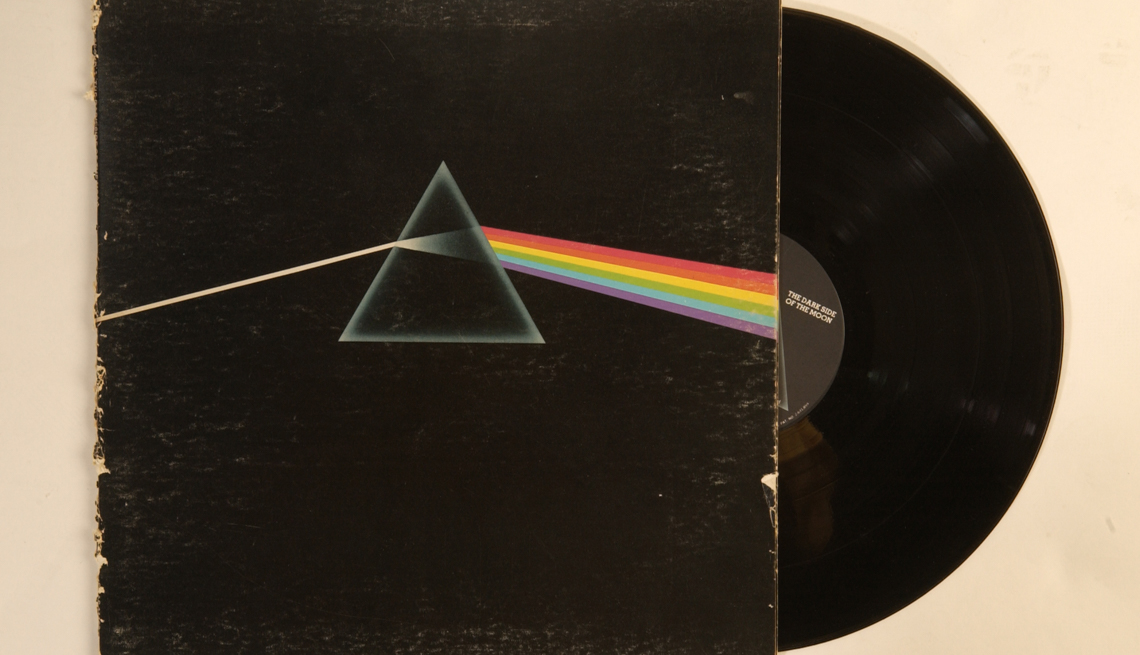 item 31 of Gallery image - the black album cover for the Dark Side of the Moon with a vinyl album peaking out