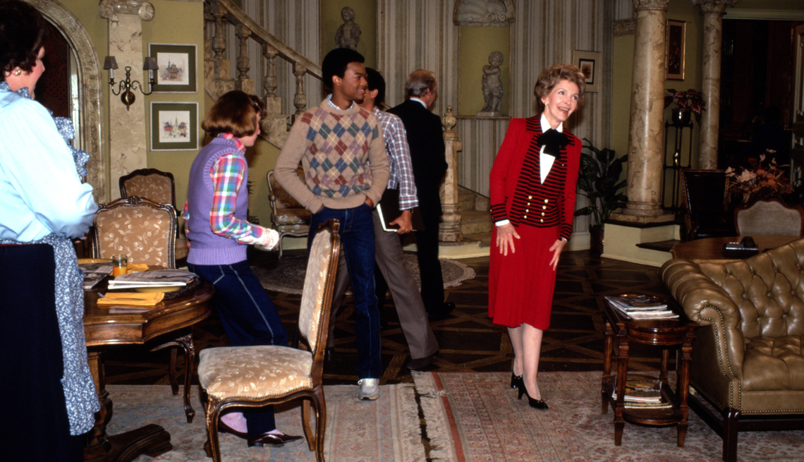 item 13 of Gallery image - Nancy Reagan in a red outfit with actor Todd Anthony Bridges on the set of Diff'rent Strokes