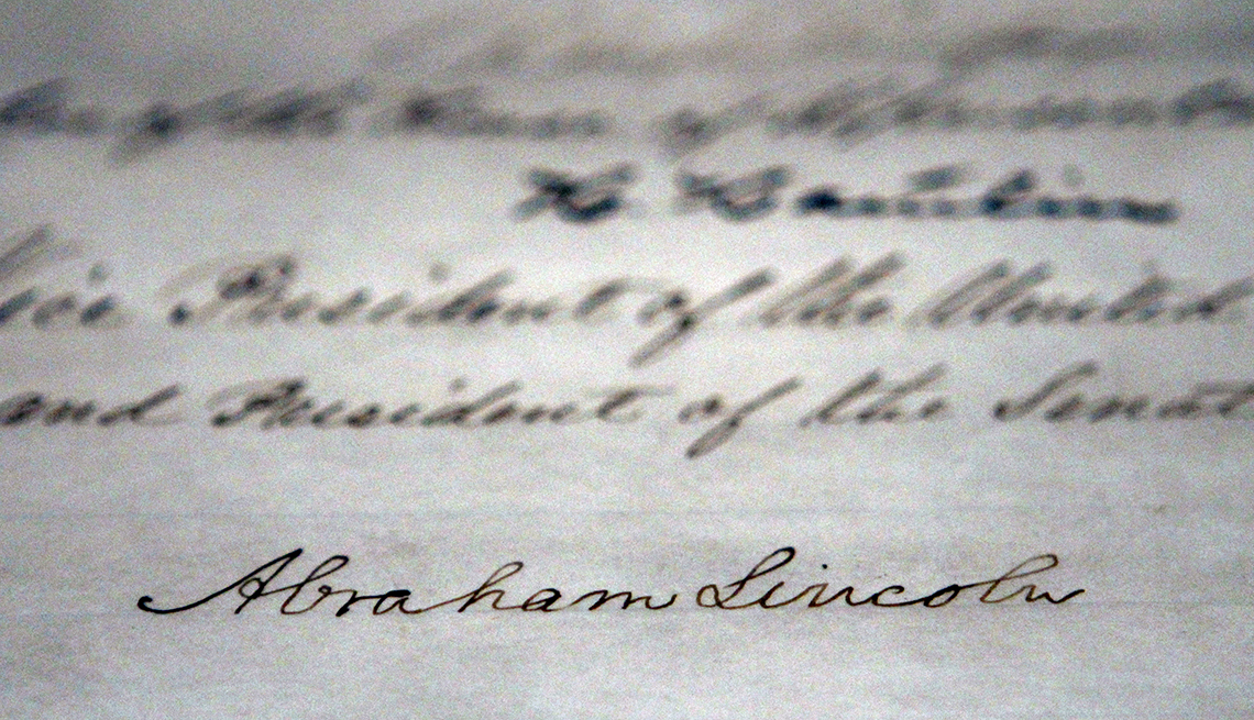 item 16 of Gallery image - Abraham Lincoln's signature is seen on the final thirteenth amendment at the National Archives