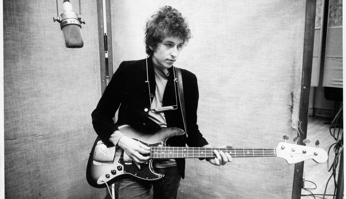 item 10 of Gallery image - Bob Dylan playing a guitar