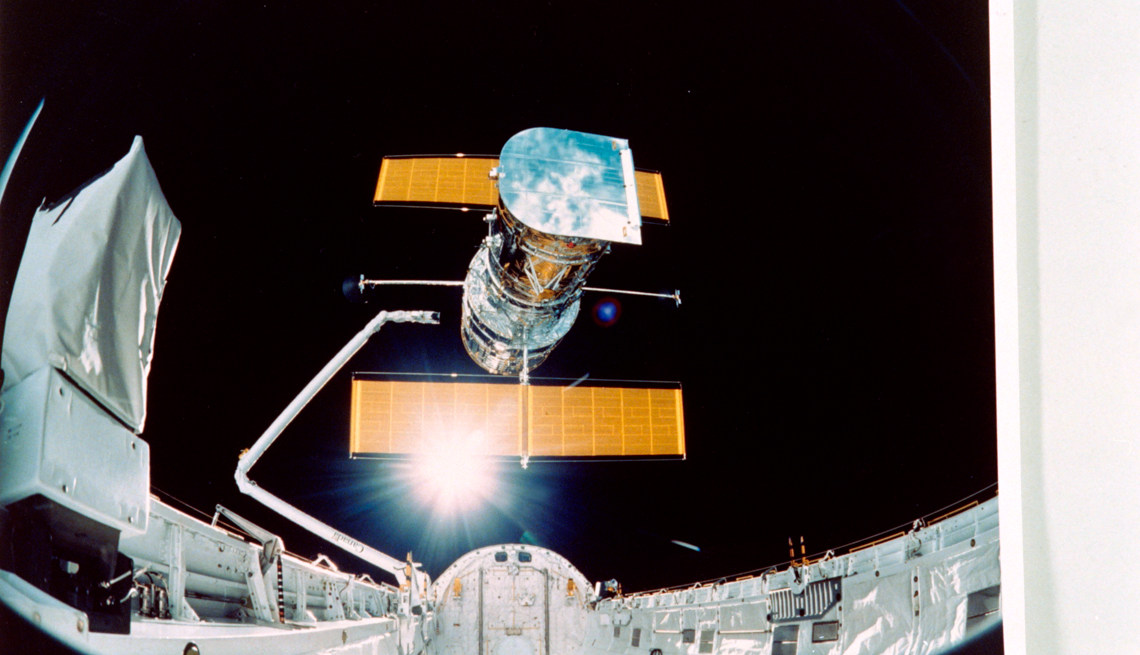 item 6 of Gallery image - Picture taken by the STS-31 crew aboard the Space Shuttle Discovery showing the Hubble Space Telescope being deployed on April 25, 1990 from the payload bay.