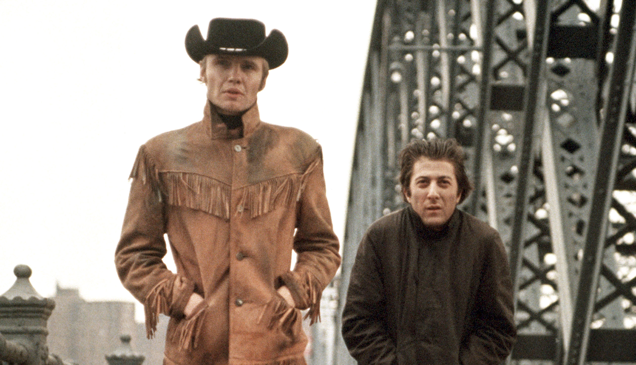 item 24 of Gallery image - John Voight and Dustin Hoffman walk along a steel bridge in the movie "Midnight Cowboy." 