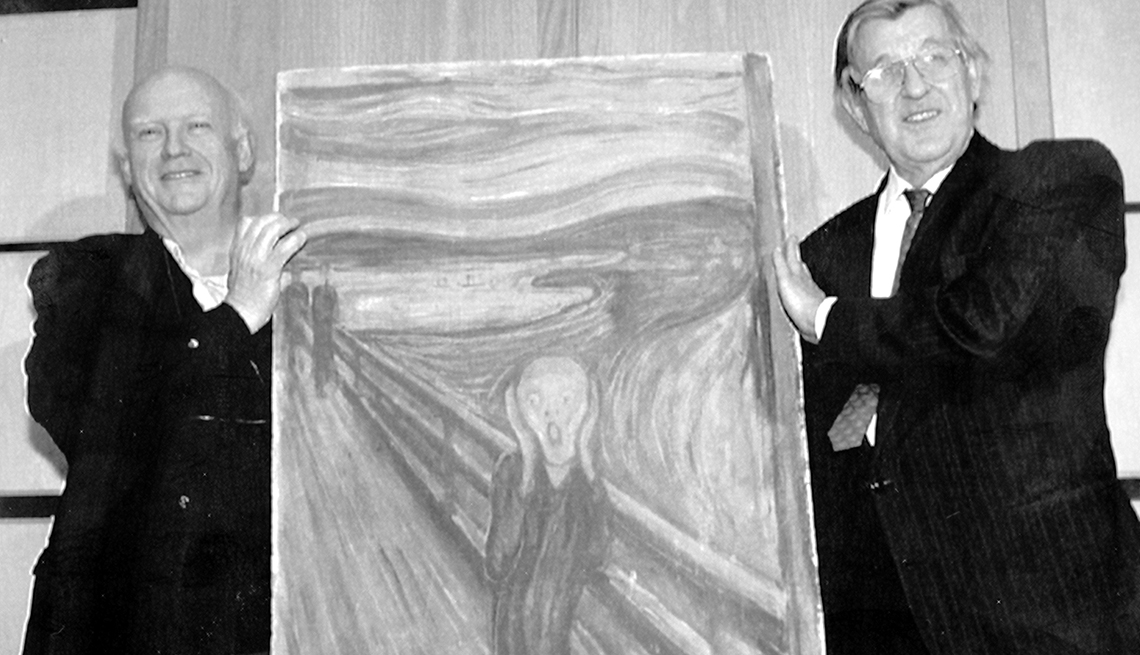 item 18 of Gallery image - The director of The National Gallery in Oslo, Knut Berg (right) and curator at the museum, Leif Plather proudly display the famous Munch painting 'The Scream' which was recovered Saturday May 7th, 1994, after been stolen from the National Museum