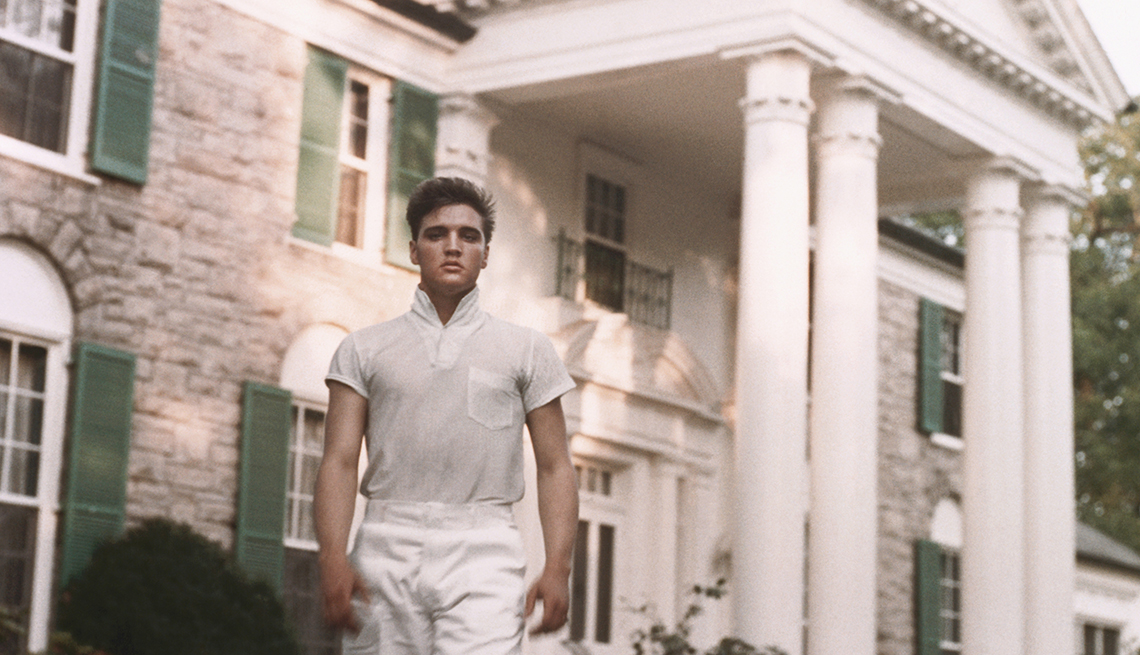item 20 of Gallery image - Rock and roll singer Elvis Presley strolls the grounds of his Graceland estate