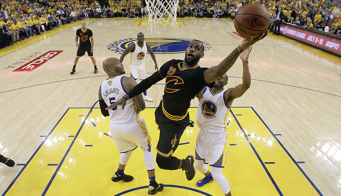 item 8 of Gallery image - Cleveland Cavaliers forward LeBron James (23) shoots against the Golden State Warriors during the first half of Game 7 of basketball's NBA Finals in Oakland, Calif.
