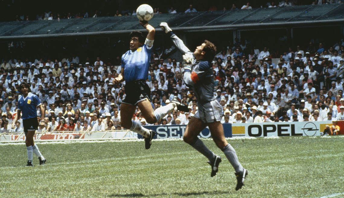 item 5 of Gallery image - Argentina's Diego Maradona scores 1st goal with his Hand of God, past England goalkeeper Peter Shilton