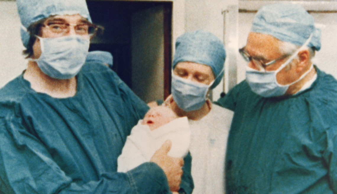 item 7 of Gallery image - The team who pioneered in-vitro fertilization, on the left Cambridge physiologist Dr Robert Edwards holding the world's first test tube baby